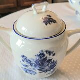 Blue and white ceramic coffee service with flowers.