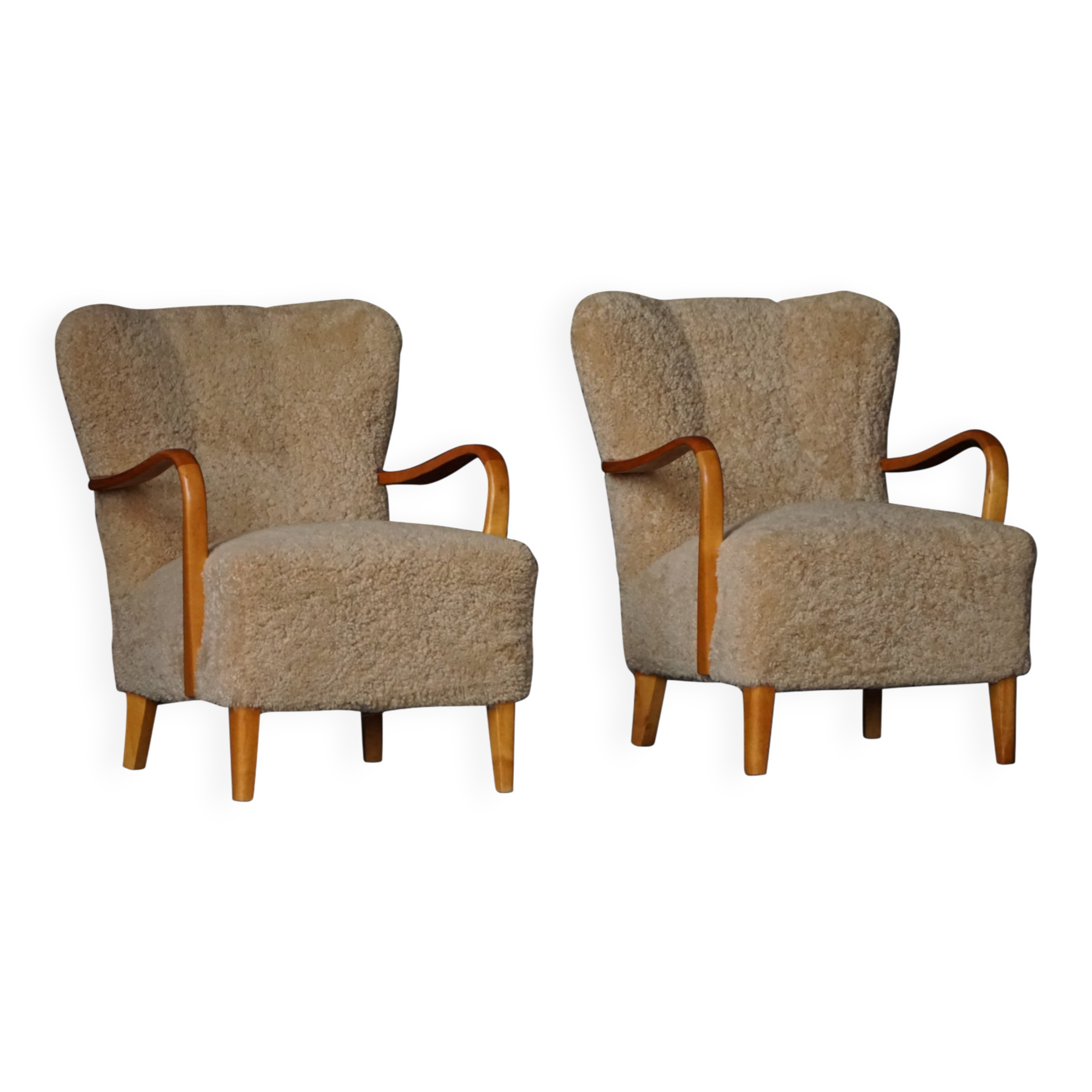 Pair of Swedish lounge chairs in birch and lamb's wool, mid-20th century, 1960.