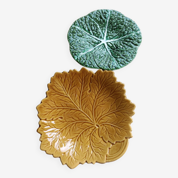 Two earthenware plates, a vine leaf and a cabbage slip