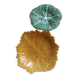 Two earthenware plates, a vine leaf and a cabbage slip