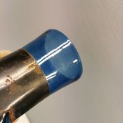 Brutalist style vase with inner blue glass mouth-blown out through the metal "frame".