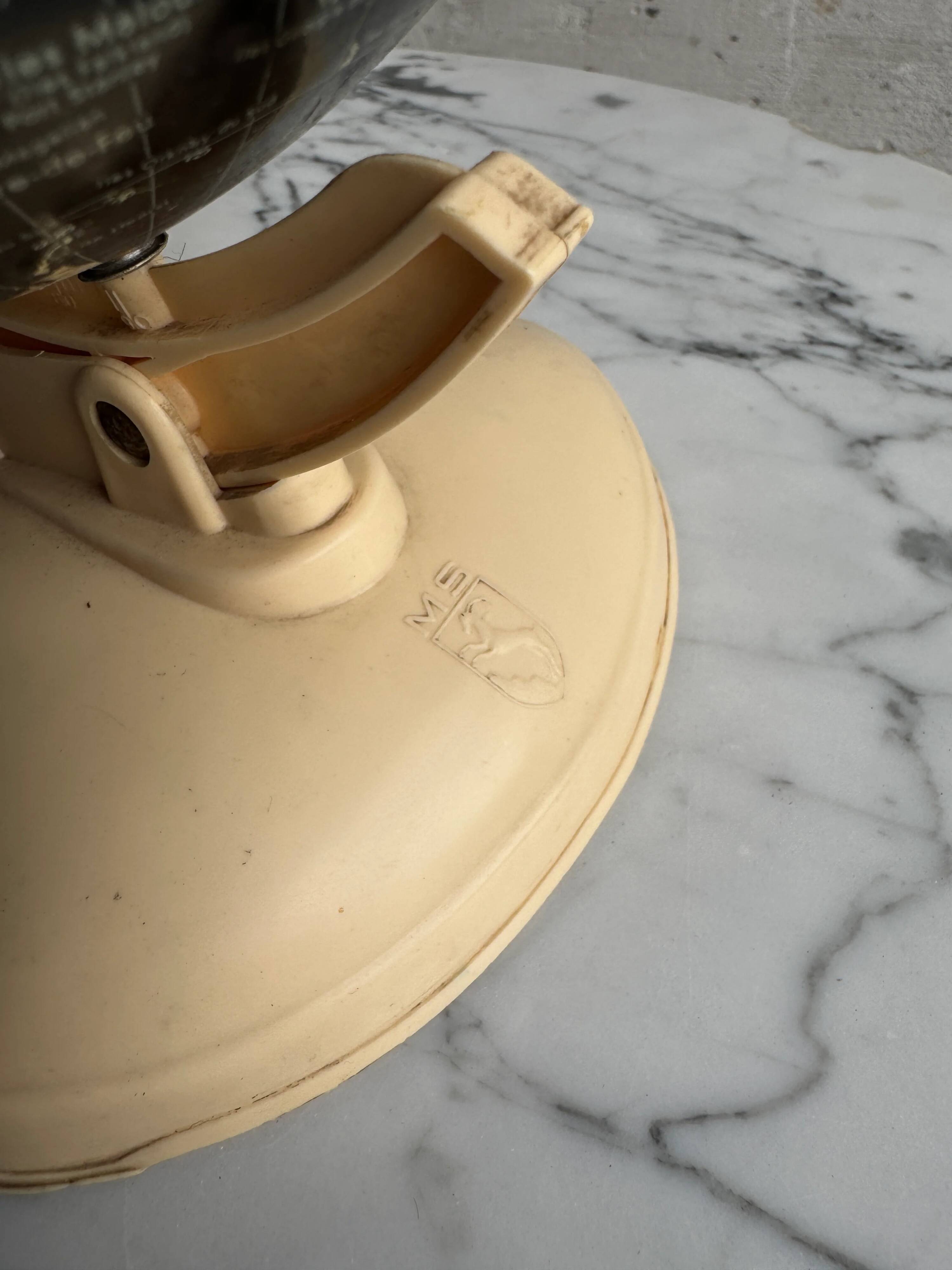 French mid-century school globe with black oceans on printed paper, cream plastic base