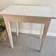Old small table with a white patina / desk