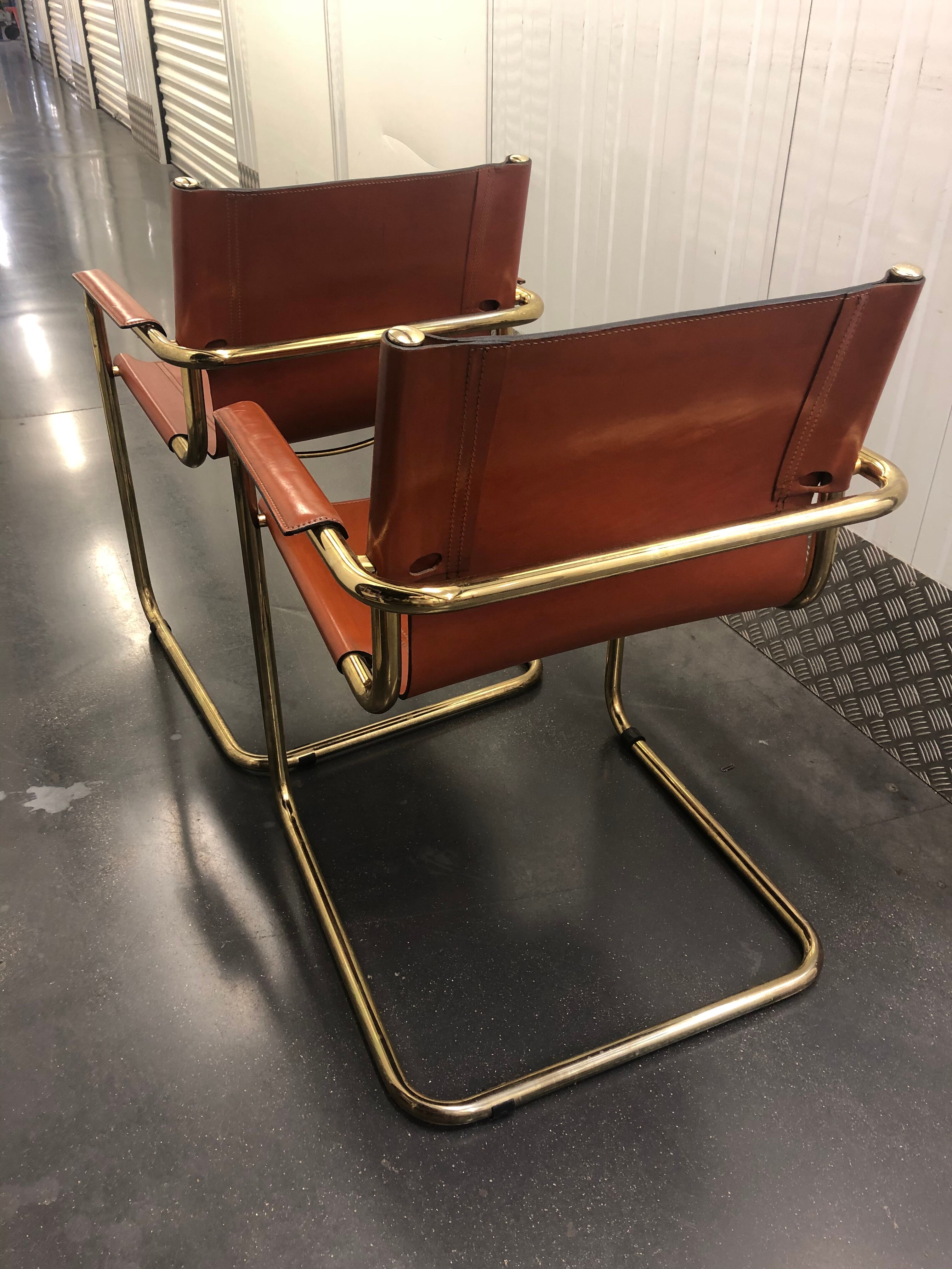 Pair of Cantilever armchairs tawny leather circa 1970