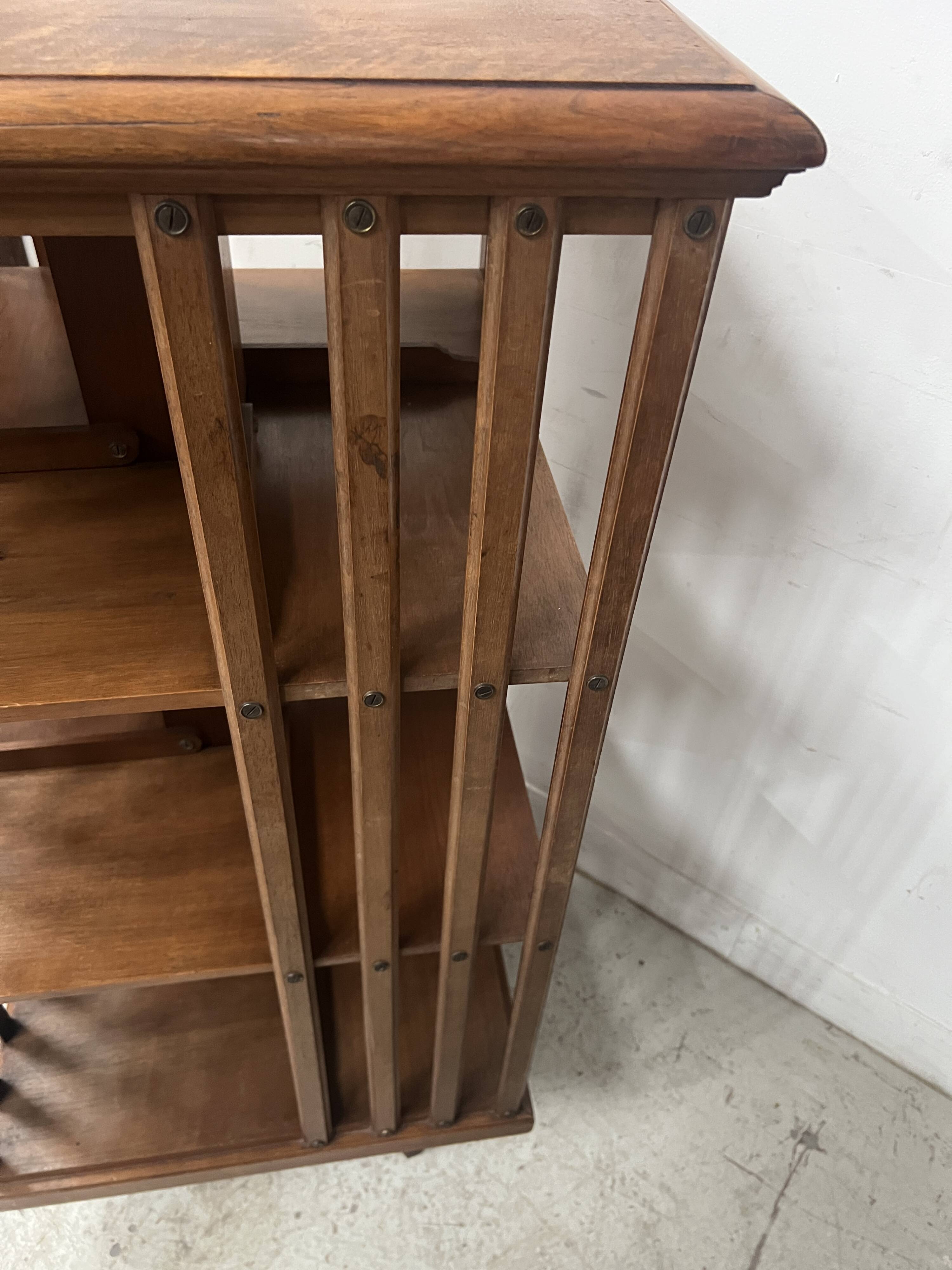 Rotating library in solid walnut, 20th century.