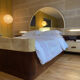Bed with integrated bedside in rosewood and parchment, art deco period, twentieth century