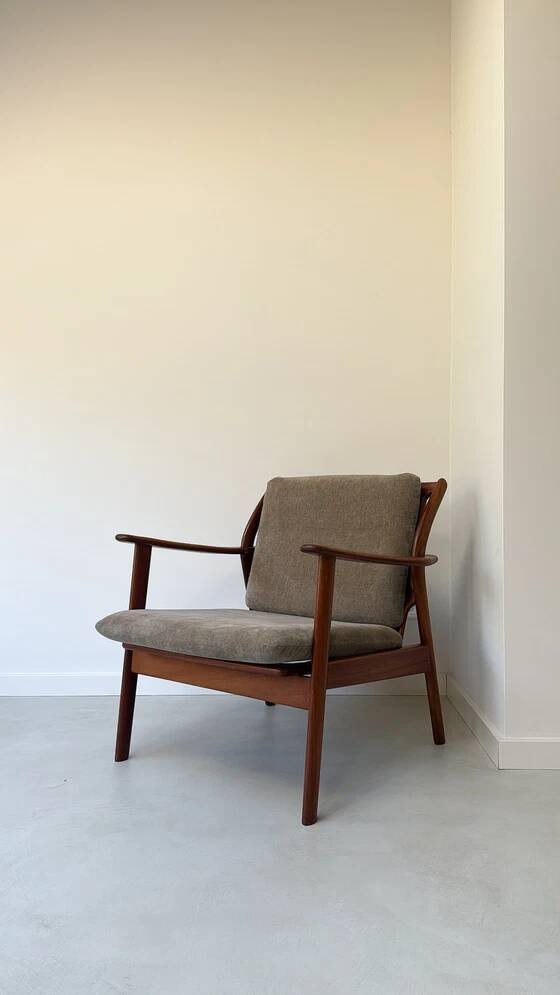 Vintage teak wooden armchair