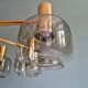Large designer chandelier in brass and smoked glass globes, 1970s
