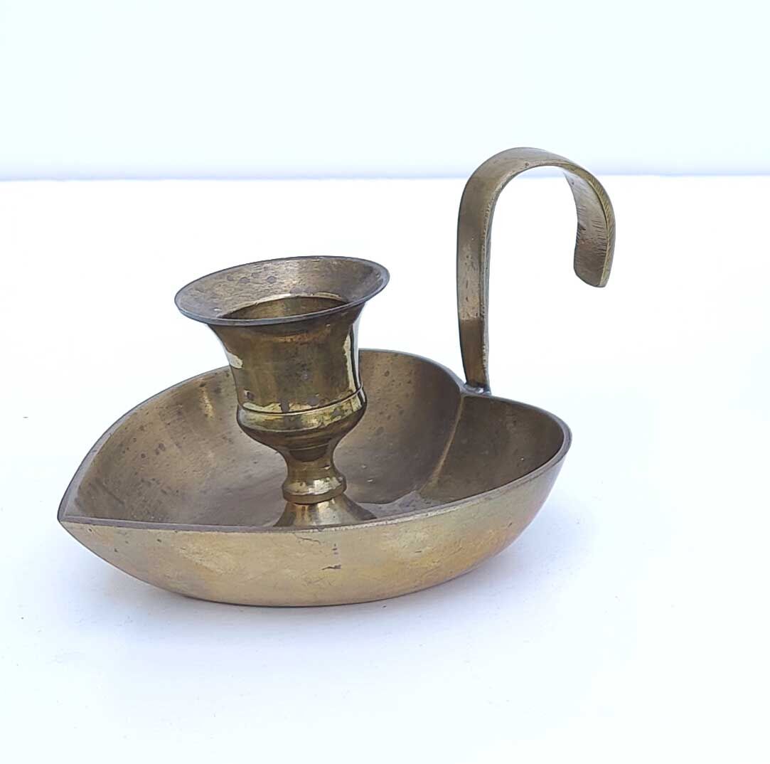 Heart-shaped brass candle holder