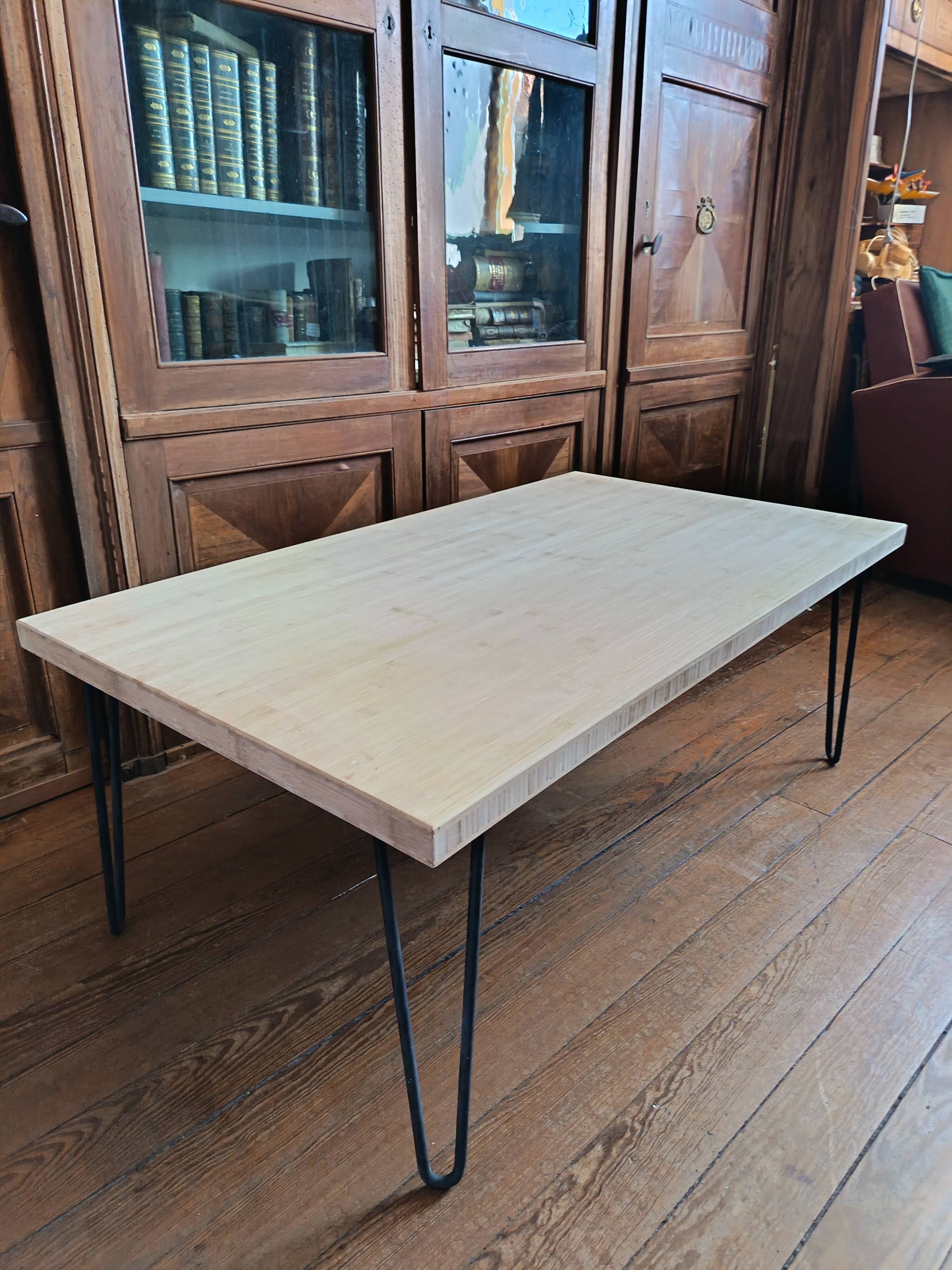 Coffee table in solid bamboo with steel legs.