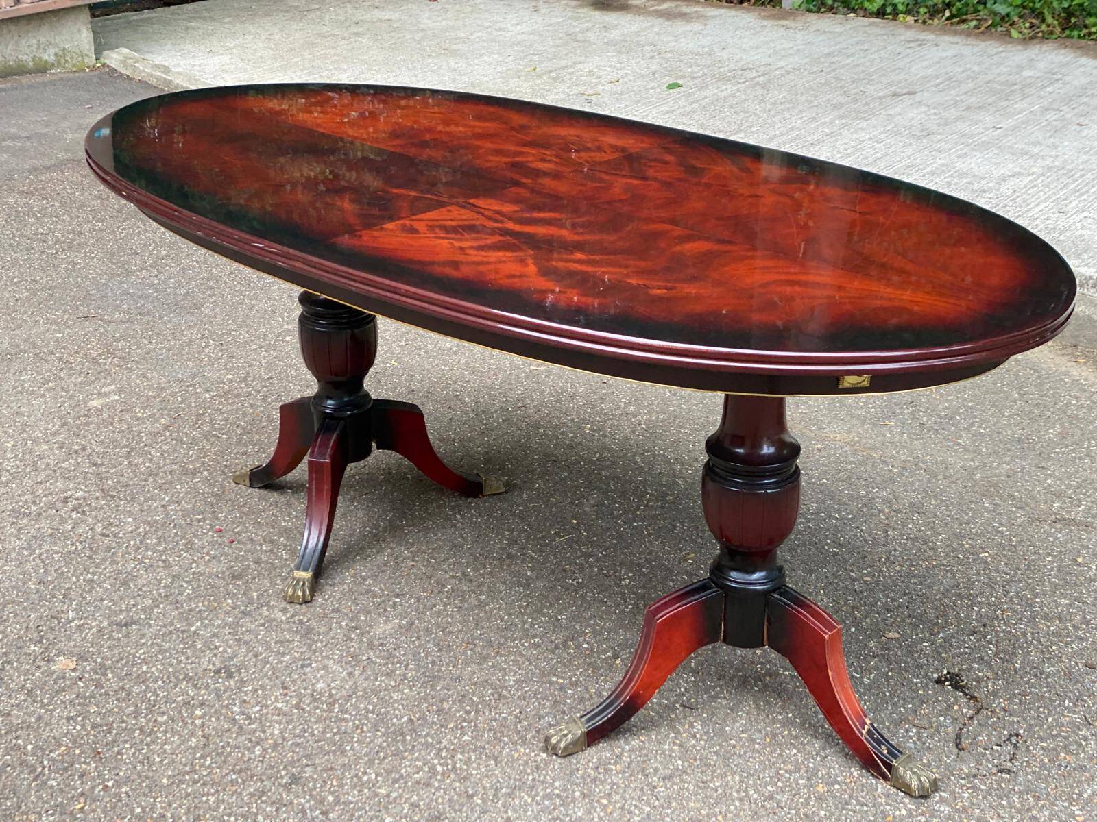 Glossy mahogany dining table in English Regency style from the 1970s.