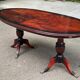 Glossy mahogany dining table in English Regency style from the 1970s.