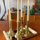 Pair of antique brass push candlesticks