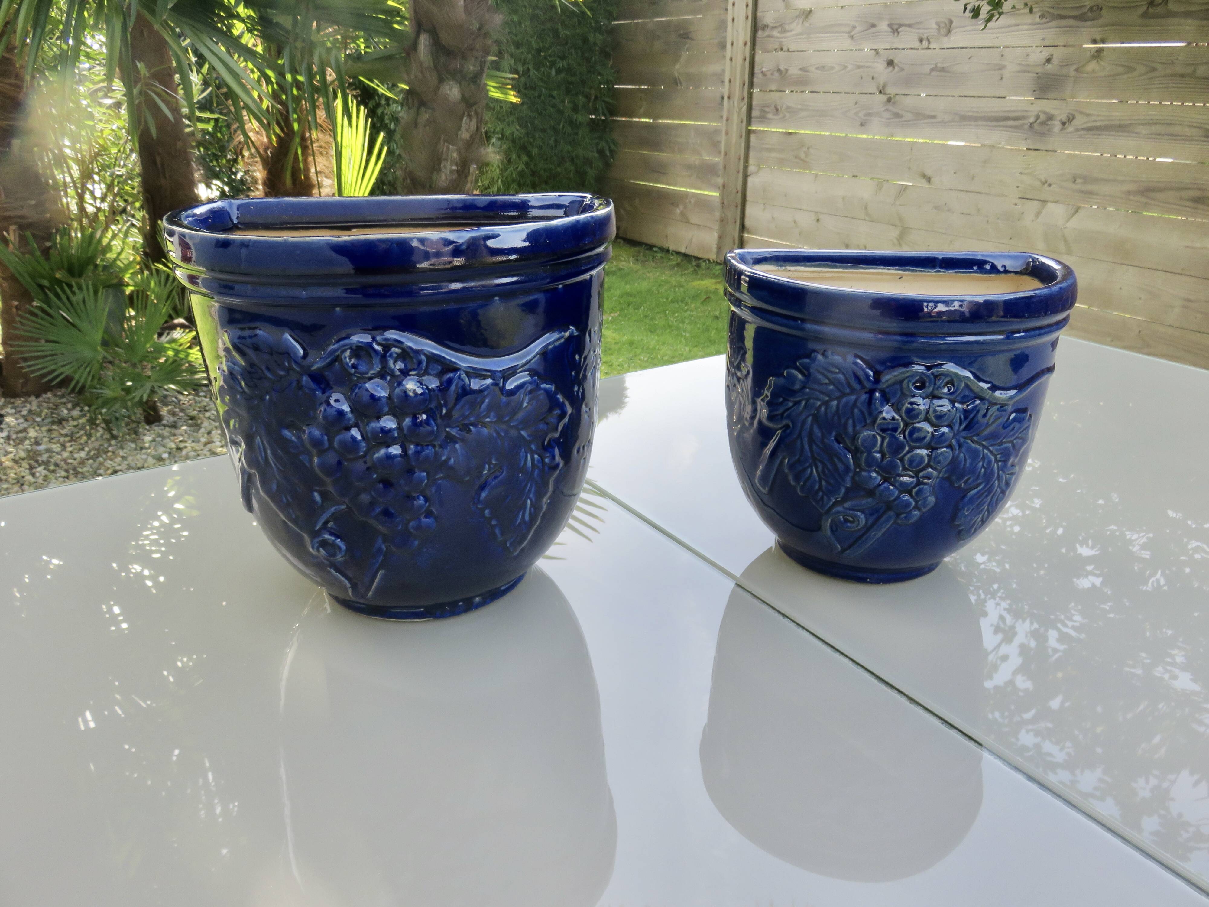 Wall pot in glazed blue terracotta with a grape motif, 1970s.