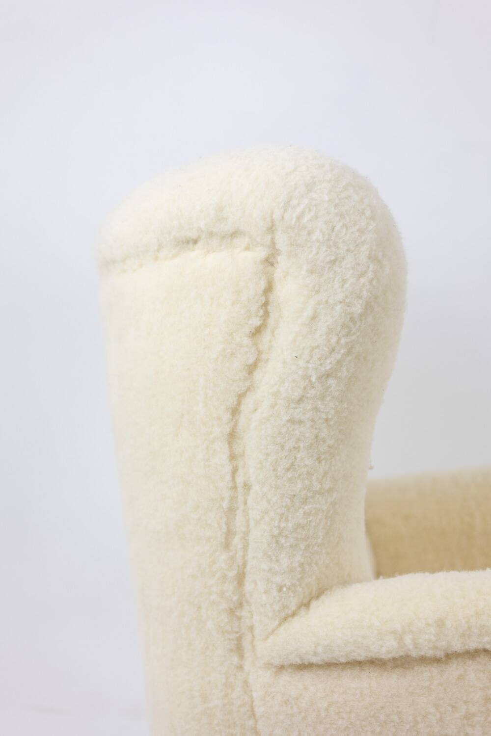 Armchair, or bergère, with its boucle fabric. 1950s