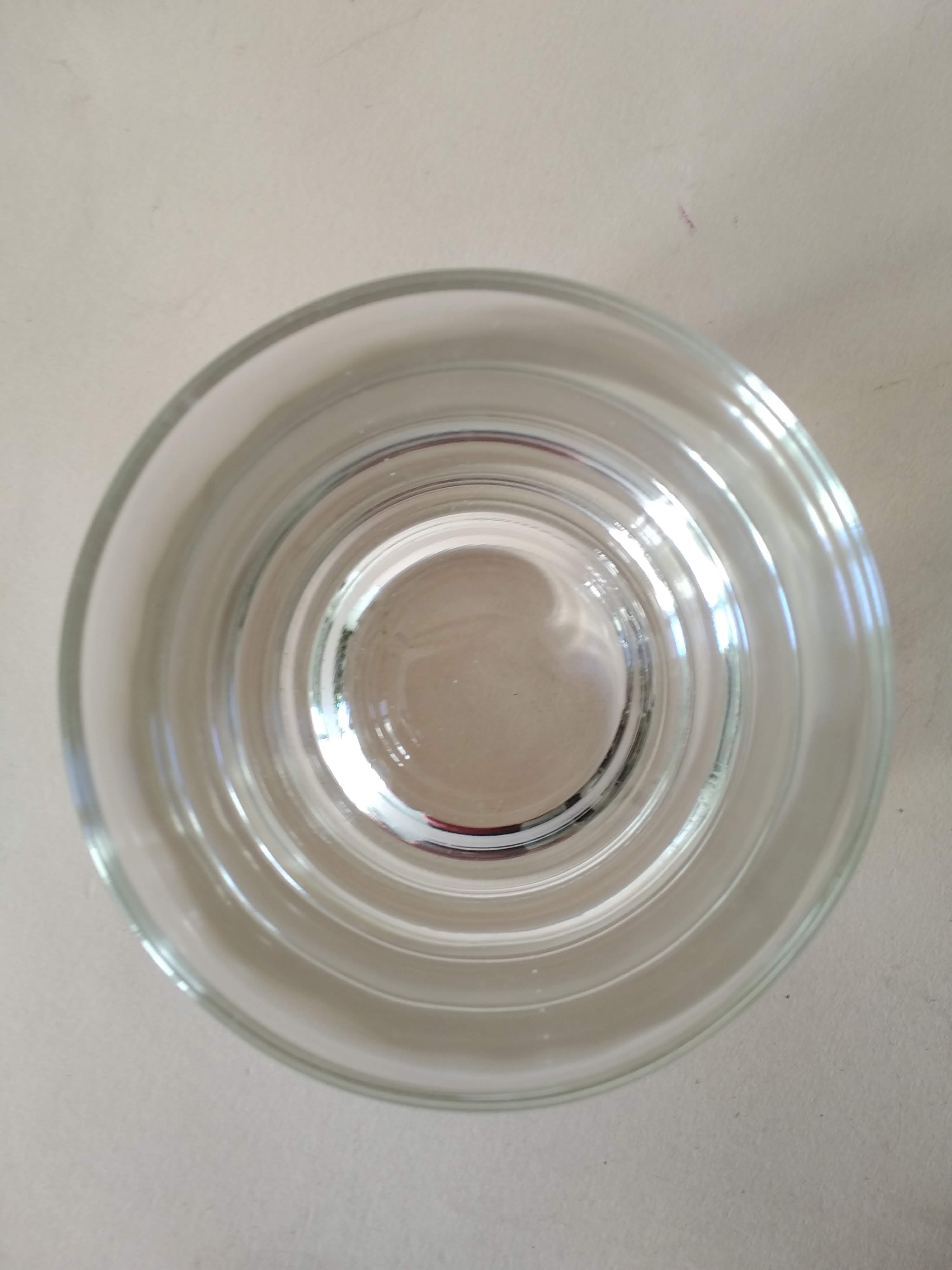 Glasses cups with thick bottom with water or vintage spirits 70