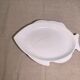 Serving dish in the shape of a white glazed ceramic fish