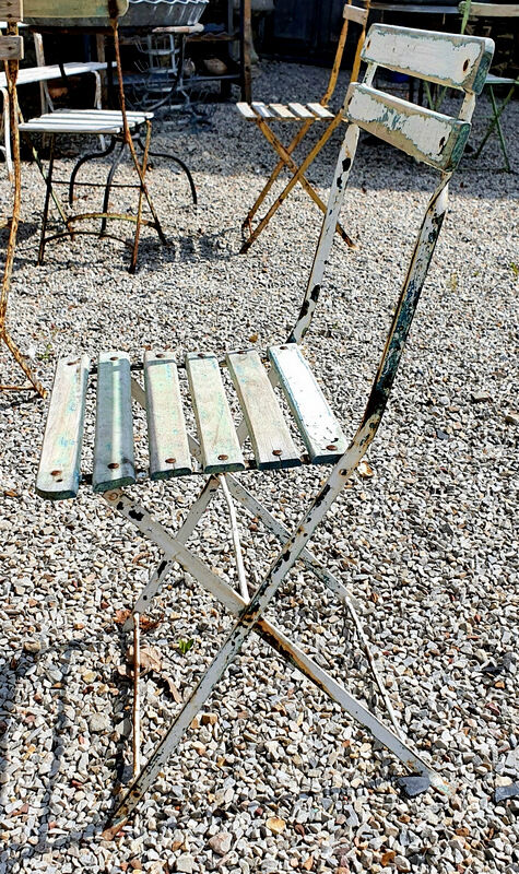 Wooden slatted garden chair with wooden slats and iron foot