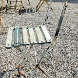 Wooden slatted garden chair with wooden slats and iron foot