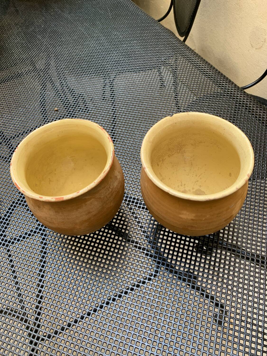 Pair of terracotta and ceramic pots