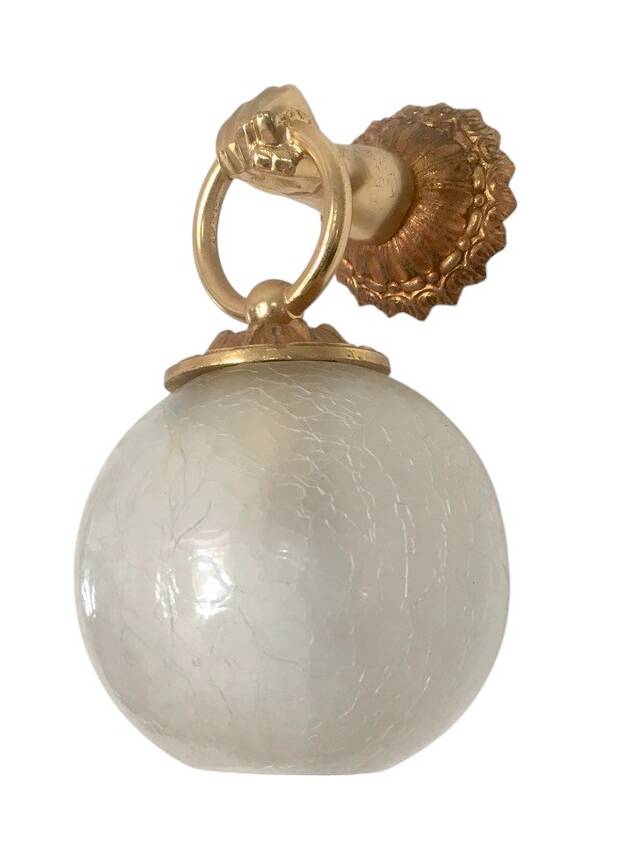 Wall light with golden hand and glass globe