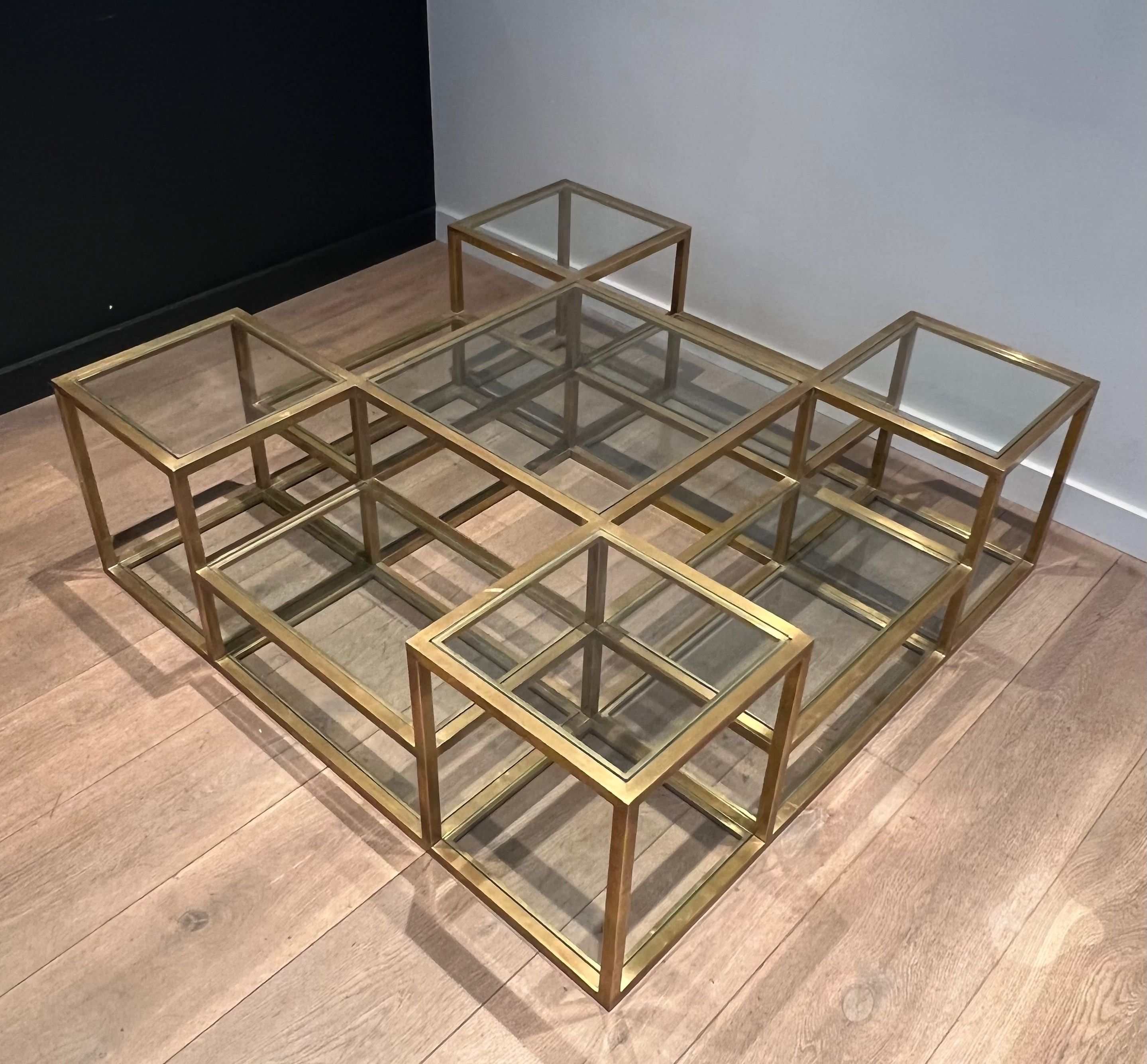 Important brass coffee table with multiple levels.