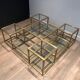 Important brass coffee table with multiple levels.