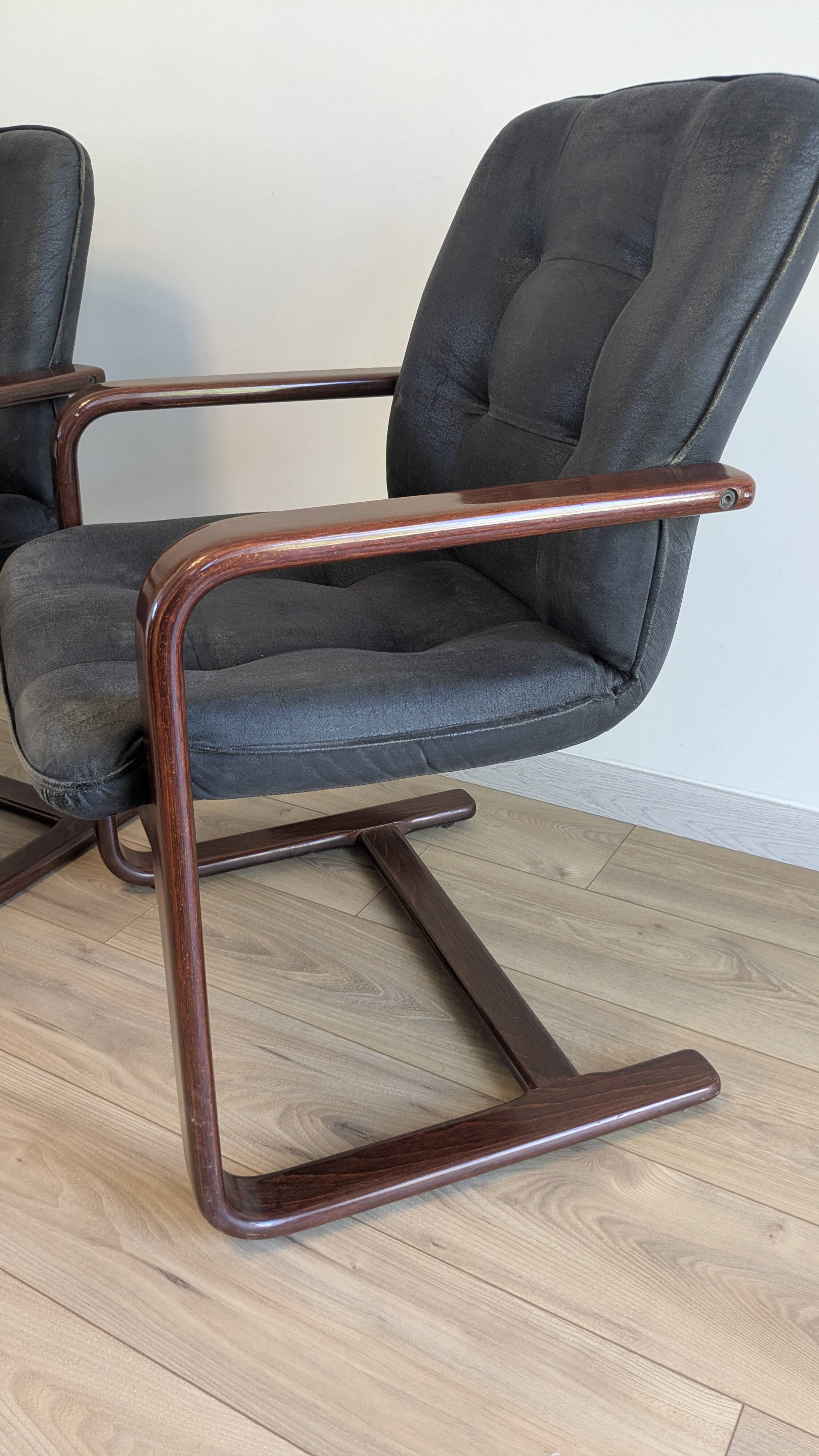 Pair of vintage cantilever armchairs in rosewood veneer.