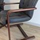 Pair of vintage cantilever armchairs in rosewood veneer.