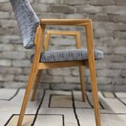 Vintage armchair from the 60s/70s in wood and grey fabric – with armrests.