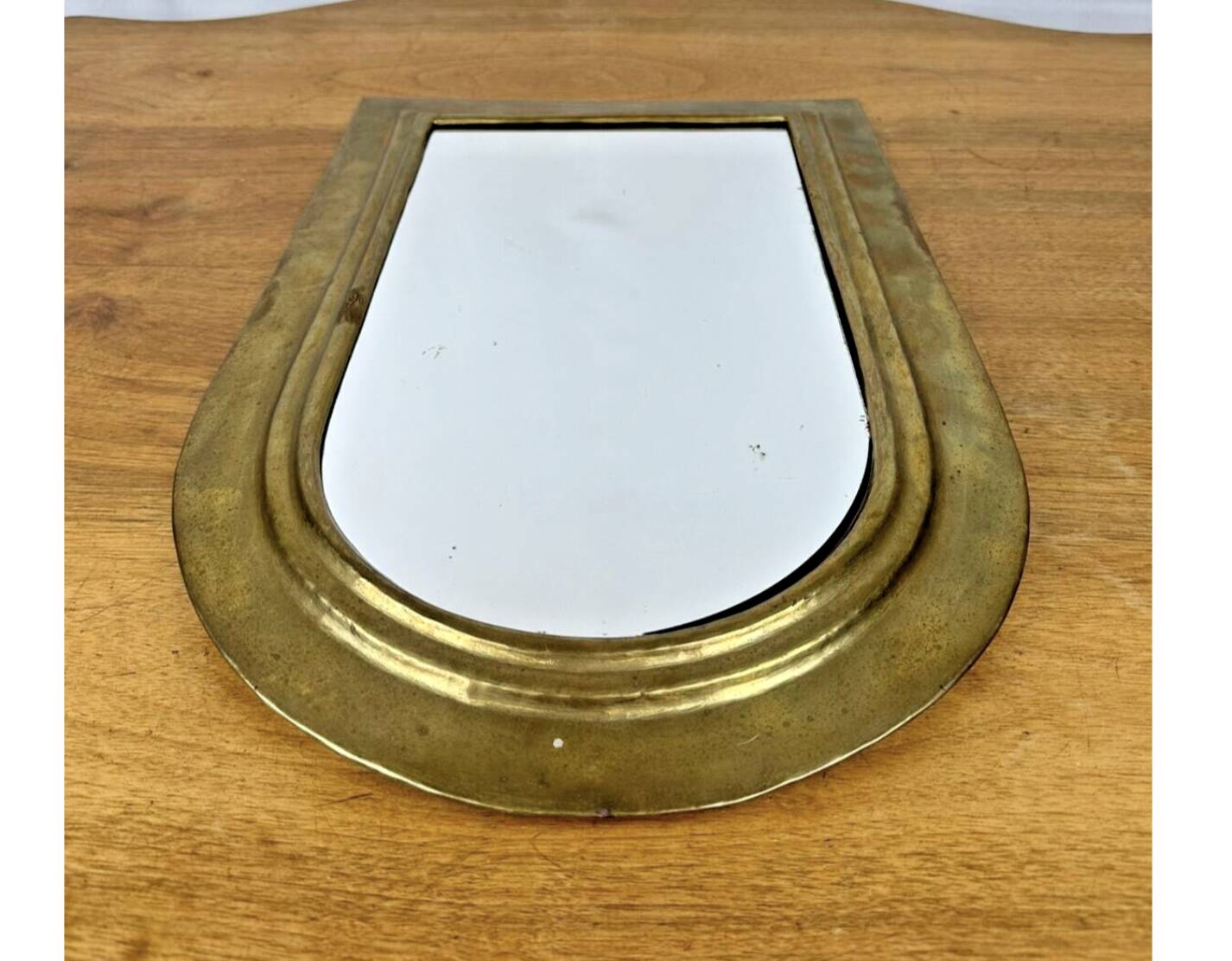 Vintage golden half-moon mirror