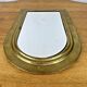 Vintage golden half-moon mirror