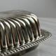 Old English butter dish in silver-plated metal and chiseled crystal.