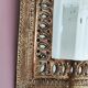 Small golden metal mirror in oriental style.