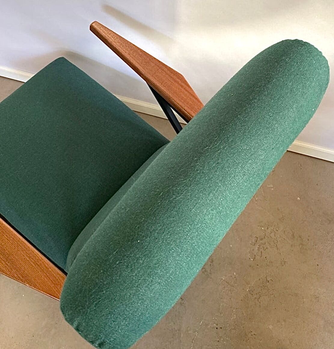 Lounge or easy chair with armrests