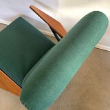 Lounge or easy chair with armrests