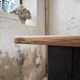 Oak farmhouse table with turned black legs.