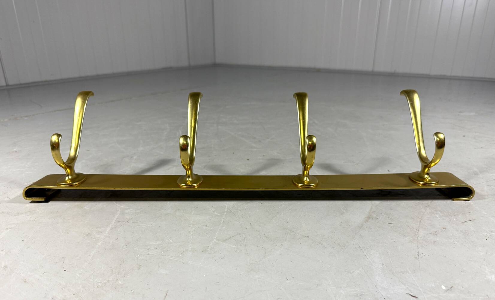 Gold coloured aluminium wall coat rack 1960’s