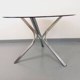 Vintage round dining table in smoked glass and chromed metal, Space Age style, from the 70s