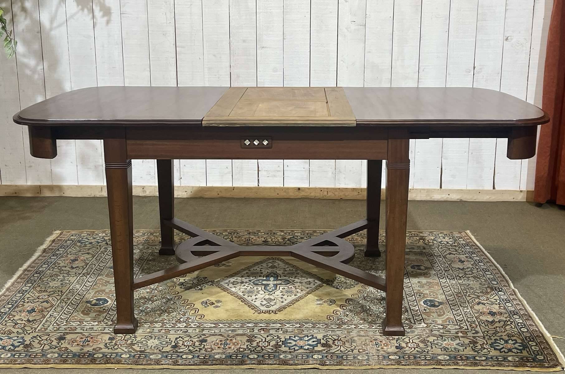 Art Nouveau dining table in mahogany in the style of Gustave Serrurier-Bovy.