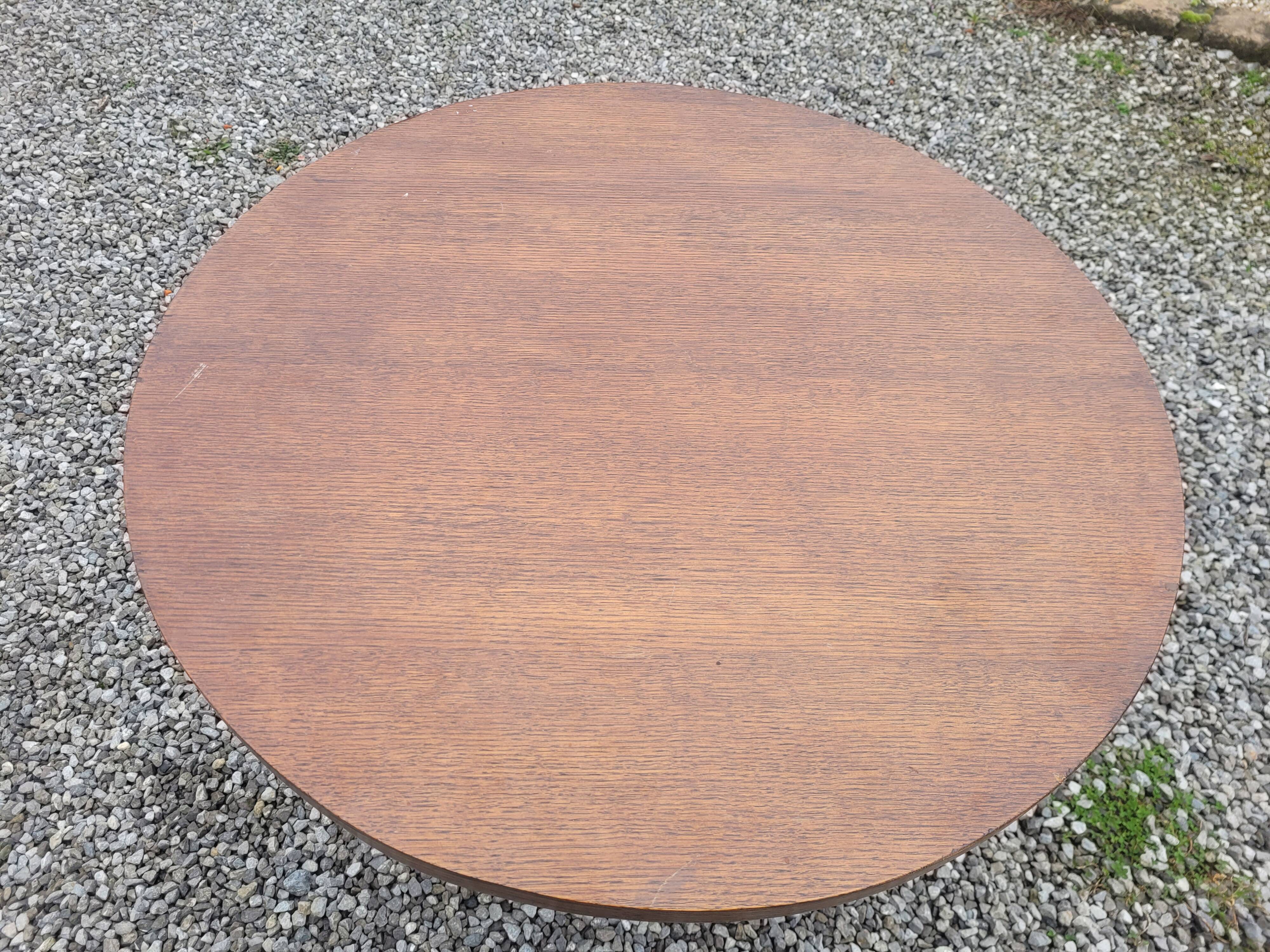 Vintage round oak coffee table with a door
