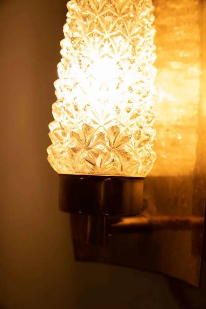 Vintage glass wall sconce from the 1960s in brass, mid-century light.