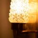 Vintage glass wall sconce from the 1960s in brass, mid-century light.