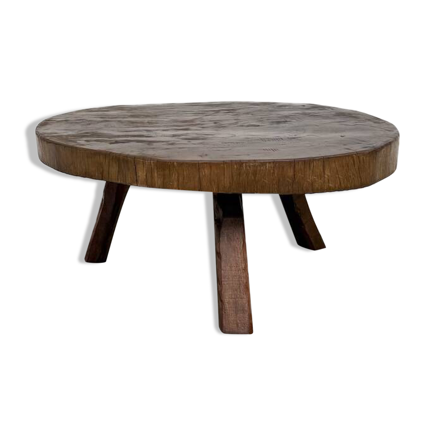 Brutalist coffee table in solid teak, monolithic slab, tripod base.