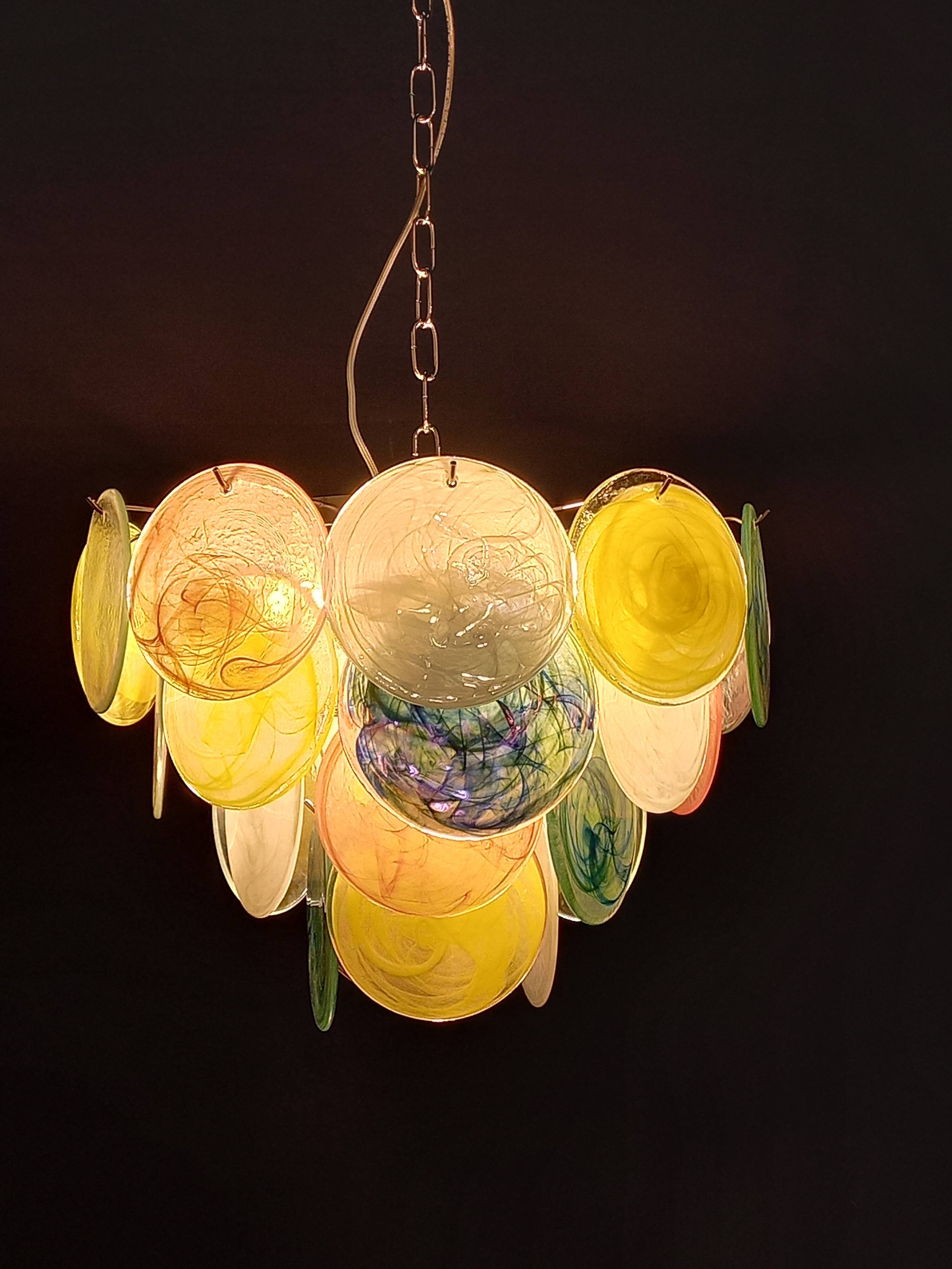 Handcrafted chandelier with Murano glass discs.