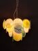 Handcrafted chandelier with Murano glass discs.