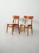 Pair of vintage teak chairs with a curved backrest