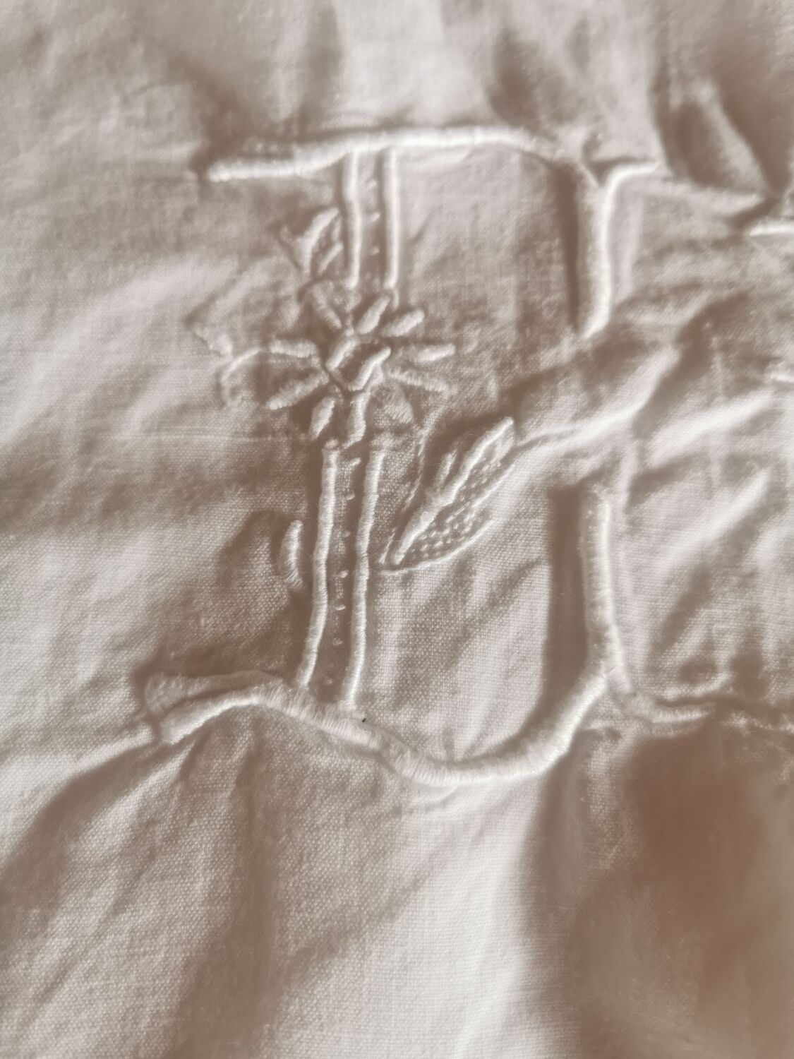 Old large monogrammed sheet hand-embroidered.