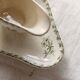 Antique sauce boat, ironstone, ivory with green floral and butterfly decoration.