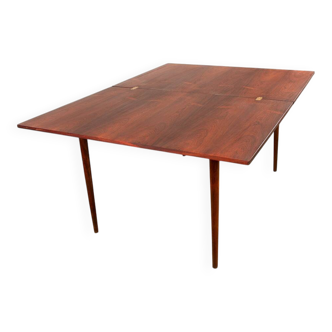 Danish extendable dining table in rosewood and brass by Poul Volther